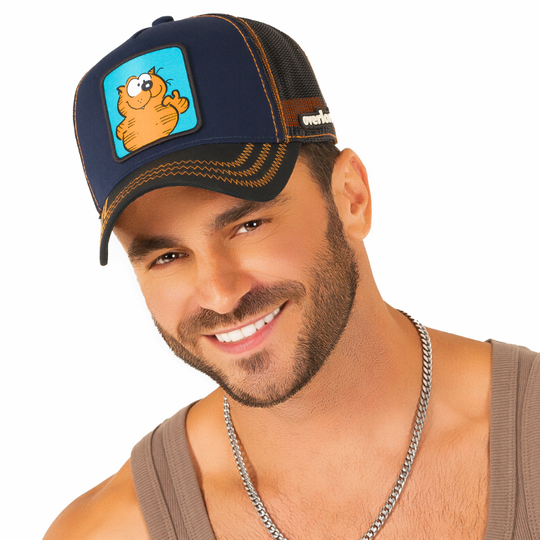 Man wearing navy blue twill trucker cap with black mesh featuring a woven patch of Heathcliff the Cat attached to the crown.