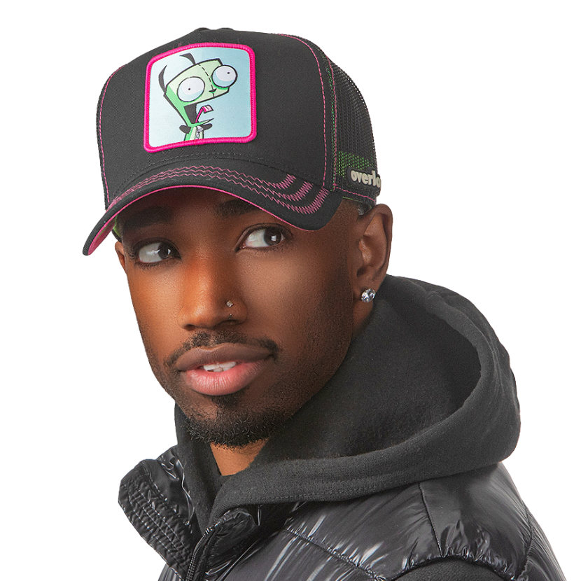 Man wearing black OVERLORD X Invader Zim yeliing GIR trucker baseball cap hat with hot pink zig zag stitching. PVC Overlord logo.