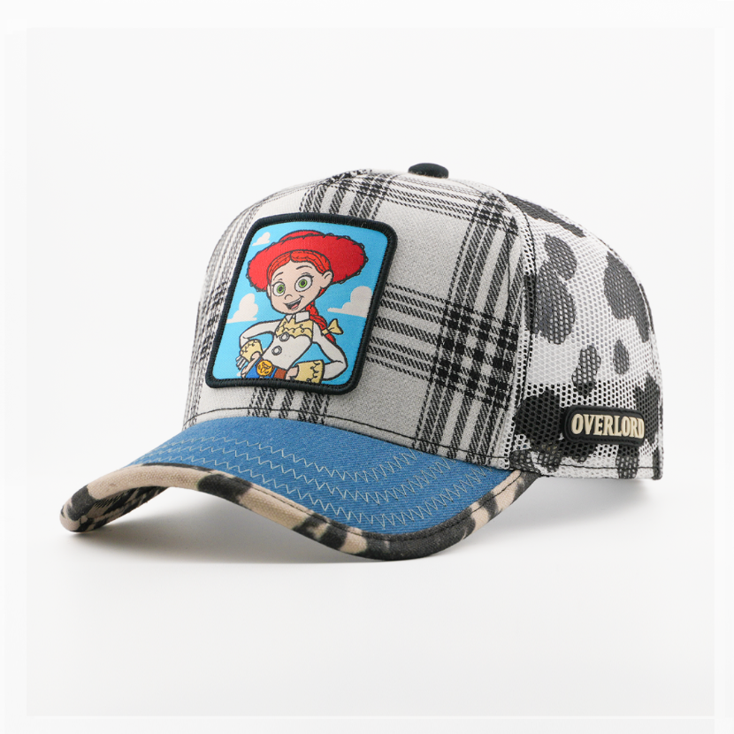 Plaid patterned cap with cartoon character patch on a white background