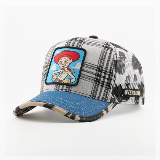 Plaid patterned cap with cartoon character patch on a white background
