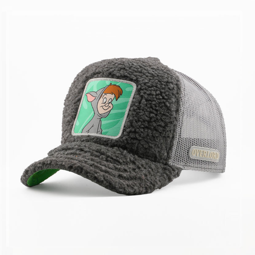 Charcoal boucle-textured First Twin from Disney's Peter Pan retro trucker cap with a green underbrim, gray mesh side, and Overlord logo.
