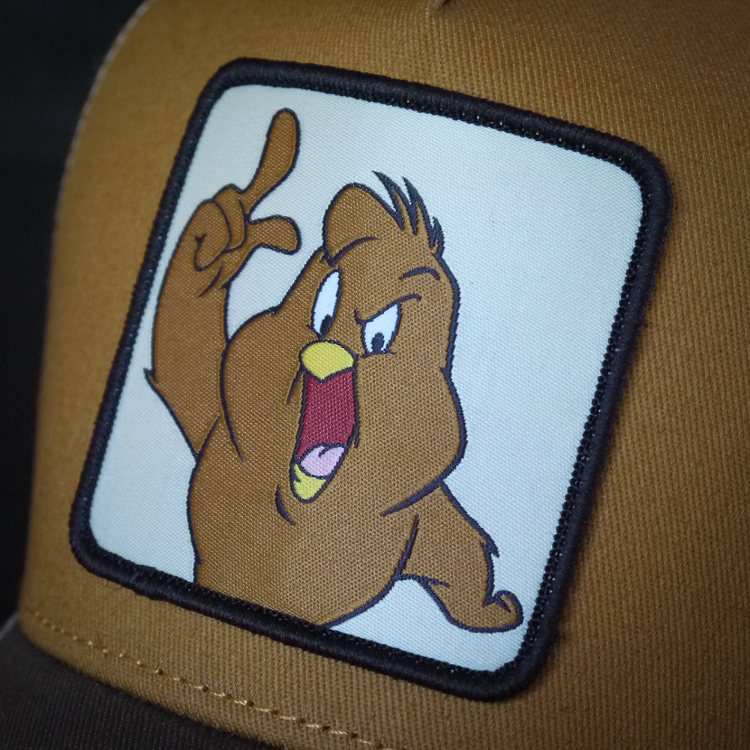Brown OVERLORD X Looney Tunes Henry Hawk trucker baseball cap hat woven Overlord patch closeup.