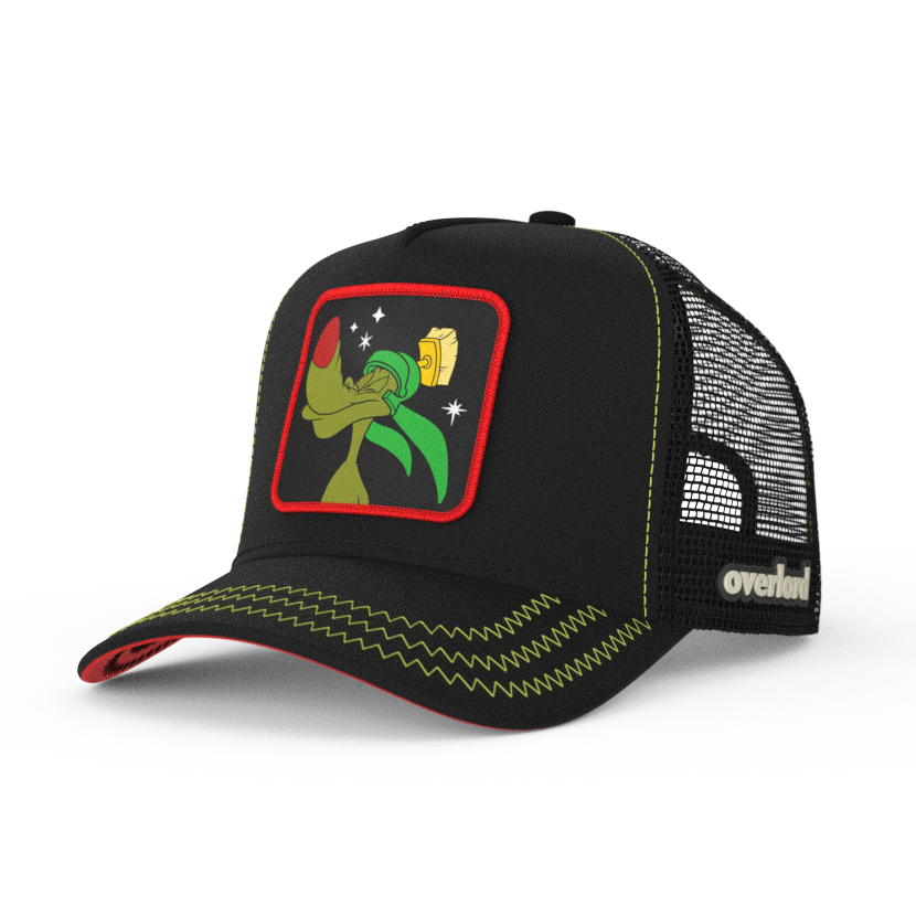 Black OVERLORD X Looney Tunes K-9 martian dog trucker baseball cap hat with green zig zag stitching. PVC Overlord logo.