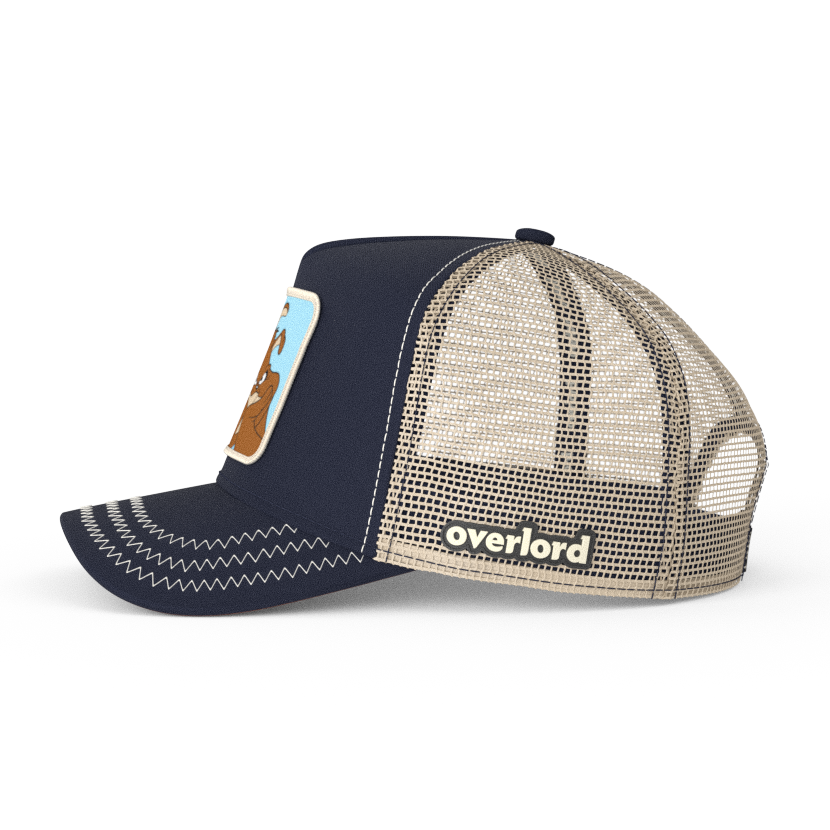 Navy Blue OVERLORD X Looney Tunes Marc Anthony the dog trucker baseball cap hat with khaki mesh. PVC Overlord logo.