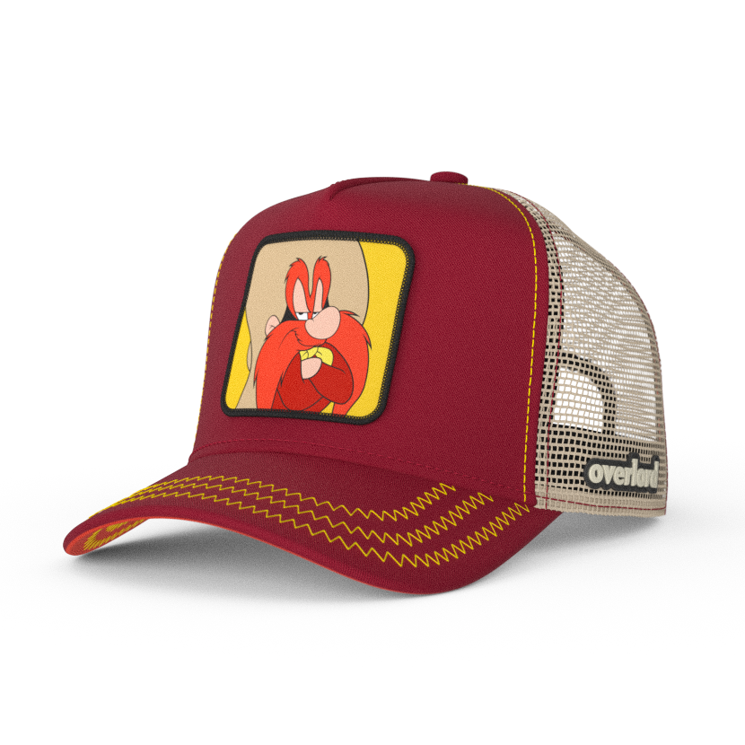 Dark Red OVERLORD X Looney Tunes smug Yosemite Sam trucker baseball cap hat with yellow zig zag stitching. PVC Overlord logo.