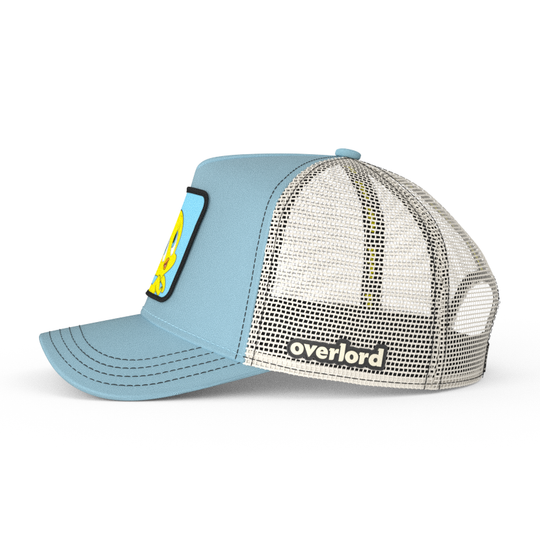 Baby Blue OVERLORD X Looney Tunes smiling Tweety Bird trucker baseball cap hat with cream mesh. PVC Overlord logo.