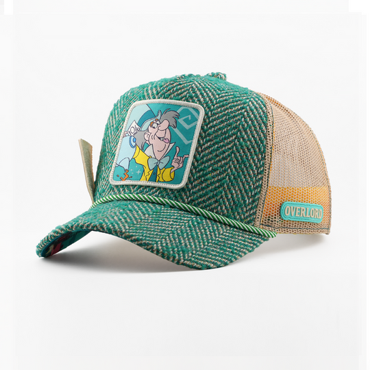 Green and beige cap with cartoon character patch on a white background
