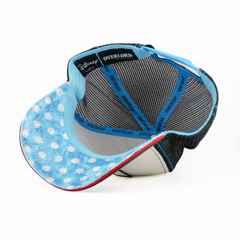Blue polka dot visor cap with gray mesh back on a white background