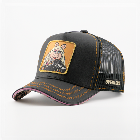 Black faux-leather retro trucker cap with a leopard-print brim underside and a patch of Miss Piggy from The Muppets in a leopard-print jacket on an orange background, black mesh back with tan Overlord logo.