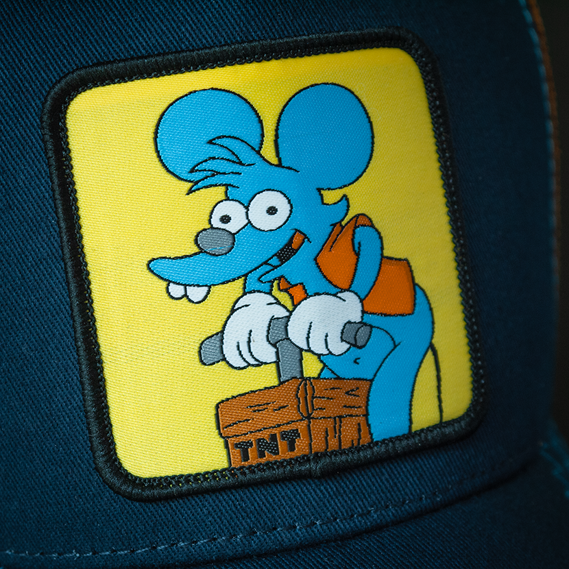 Navy OVERLORD X The Simpsons Itchy the mouse with TNT trucker baseball cap hat with blue stitching. Woven Overlord patch.