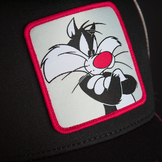 Black OVERLORD X Looney Tunes smug Sylvester the cat trucker baseball cap hat woven Overlord patch closeup.