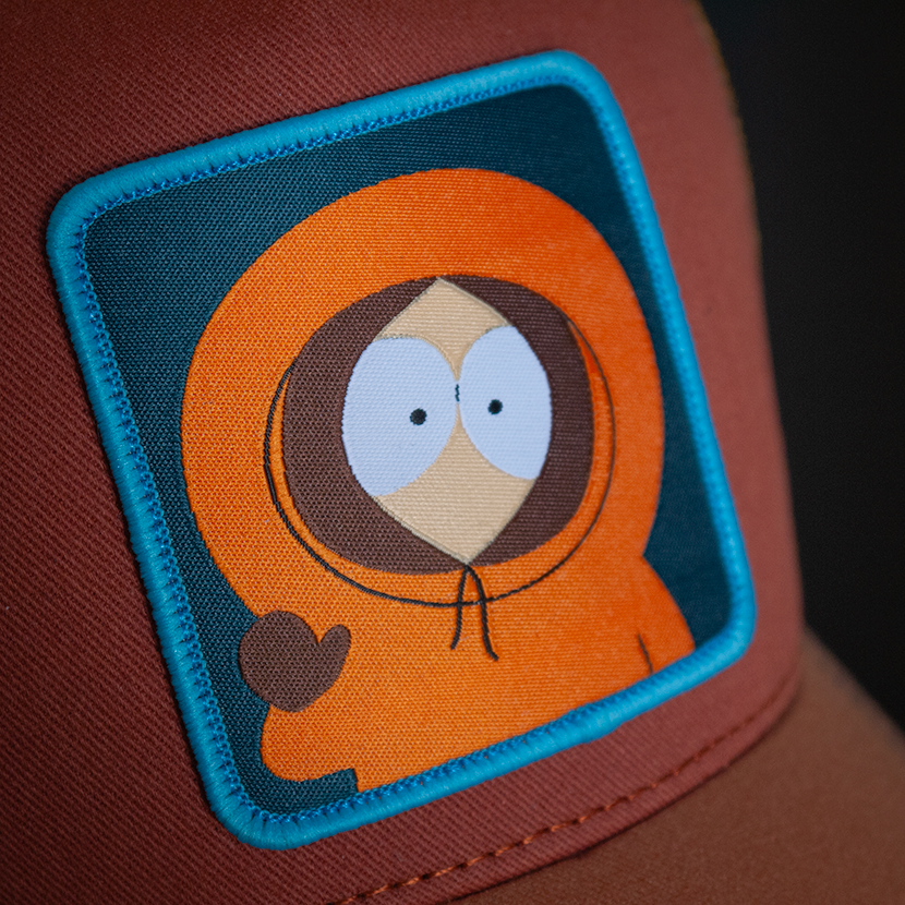 Red Brown and rust OVERLORD X South Park Kenny waving trucker baseball cap hat woven Overlord patch closeup.