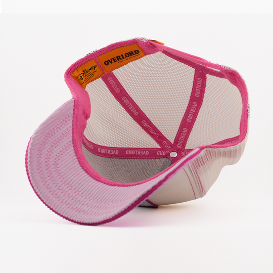 Pink and white cap with 'Overlord' branding on a white background