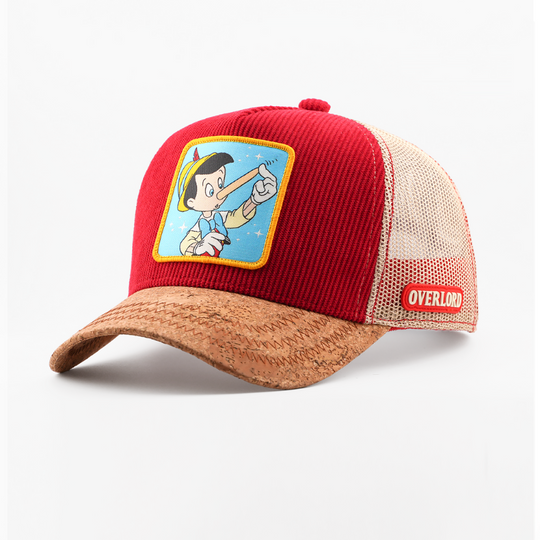 Red and brown cap with cartoon character patch on a white background