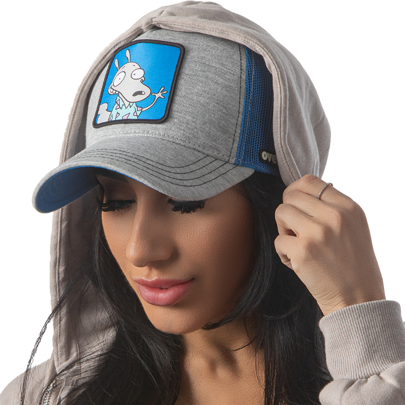 Woman wearing heather gray jersey OVERLORD X Rocko's Modern Life Rocko trucker baseball cap hat with black stitching. PVC Overlord logo.