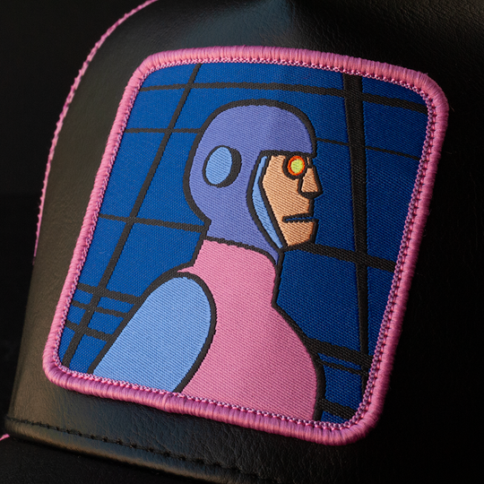 Close-up of a woven patch of Funland Robot villain from Scooby Doo attached to the crown.