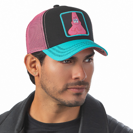 Man wearing black and turquoise OVERLORD X SpongeBob sneaky Patrick trucker baseball cap hat with black zig zag stitching. PVC Overlord logo.