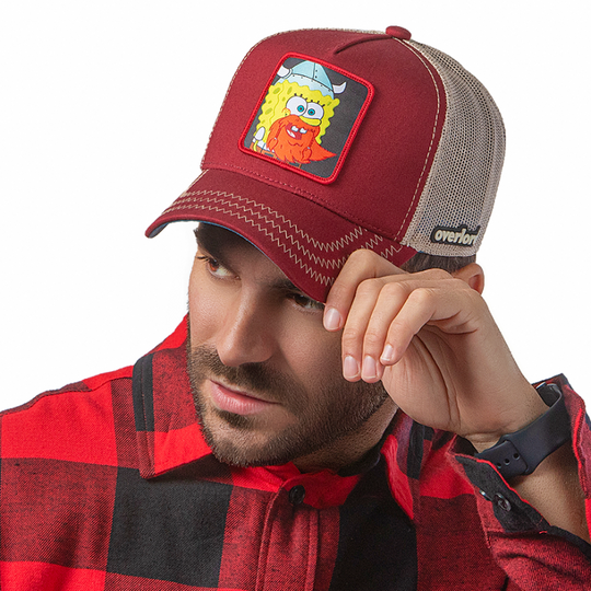 Man wearing dark red twill trucker cap with khaki mesh featuring a woven patch featuring SpongeBob Viking from SpongeBob Squarepants attached to the crown.