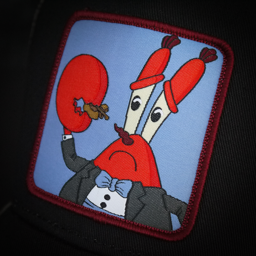 Black OVERLORD X SpongeBob Krabs playing tiny violin trucker baseball cap hat woven Overlord patch closeup.