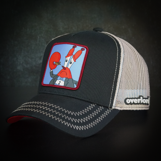 Black OVERLORD X SpongeBob Krabs playing tiny violin trucker baseball cap hat with khaki zig zag stitching. PVC Overlord logo.