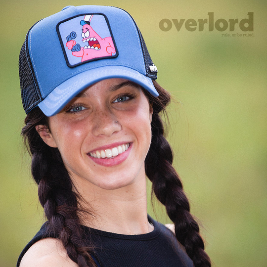 Woman wearing blue OVERLORD X SpongeBob Patrick yelling at phone trucker baseball cap hat with light blue zig zag stitching. PVC Overlord logo.