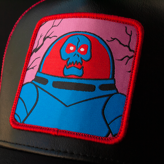 Close-up of a woven patch of Space Kook villain from Scooby Doo attached to the crown.