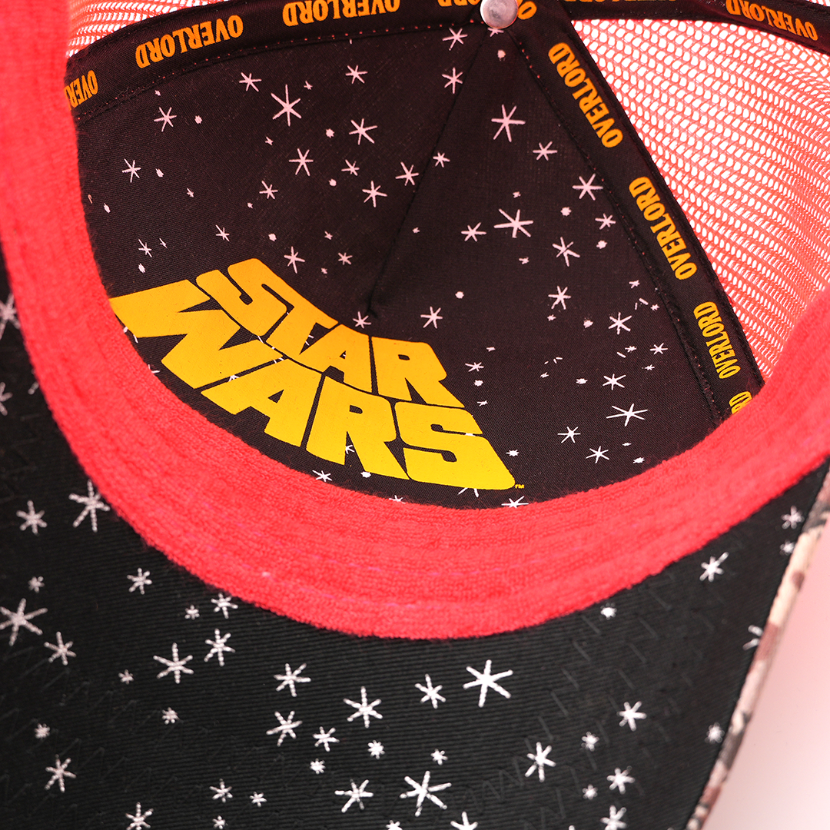 Close-up of the Sy Snootles trucker cap's underside showing a starry black lining with a yellow Star Wars logo and Overlord taping.