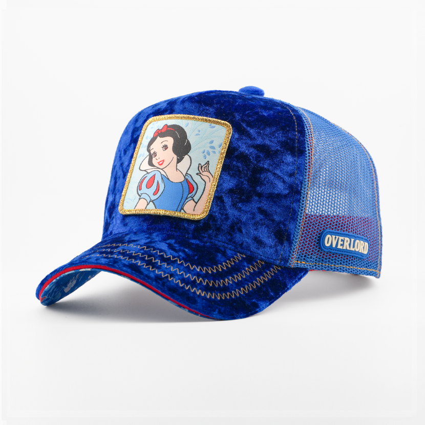 Blue velvet Snow White from Disney's Snow White and the Seven Dwarfs retro trucker cap with a gold-trimmed patch, matching mesh side, and Overlord logo.