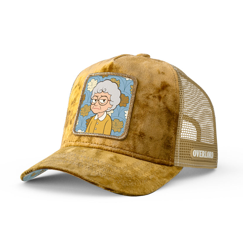 Brown trucker cap with a patch of an animated character on a white background