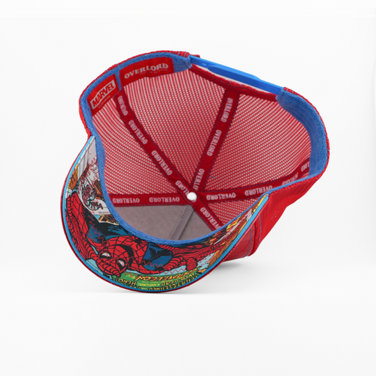 Underside view of the Spider-Man cap showing a comic-print brim, red mesh crown, and Overlord branded taping.