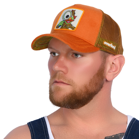 Man wearing brown cashmere wool trucker cap hat featuring Sherlock Hemlock from Sesame Street on woven patch attached to crown