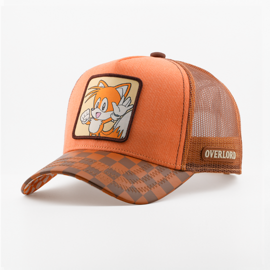 Orange retro trucker cap with Tails from Sonic the Hedgehog patch bordered in dark brown, brown checkered-pattern brim, brown mesh back, and Overlord logo.
