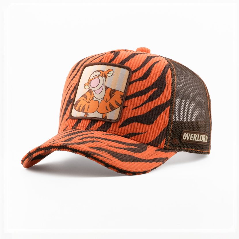 Orange and black striped cap with a cartoon character patch on a white background