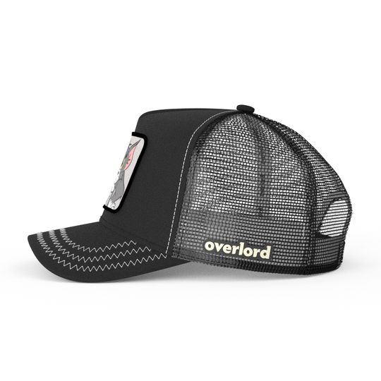 Black OVERLORD X Tom and Jerry Tom cat trucker baseball cap hat with black mesh. PVC Overlord logo.