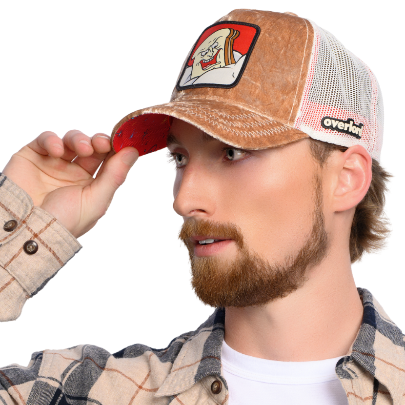 Man wearing brown crushed velvet cap hat featuring Powdered Toast Man from Ren and Stimpy on woven patch attached to crown