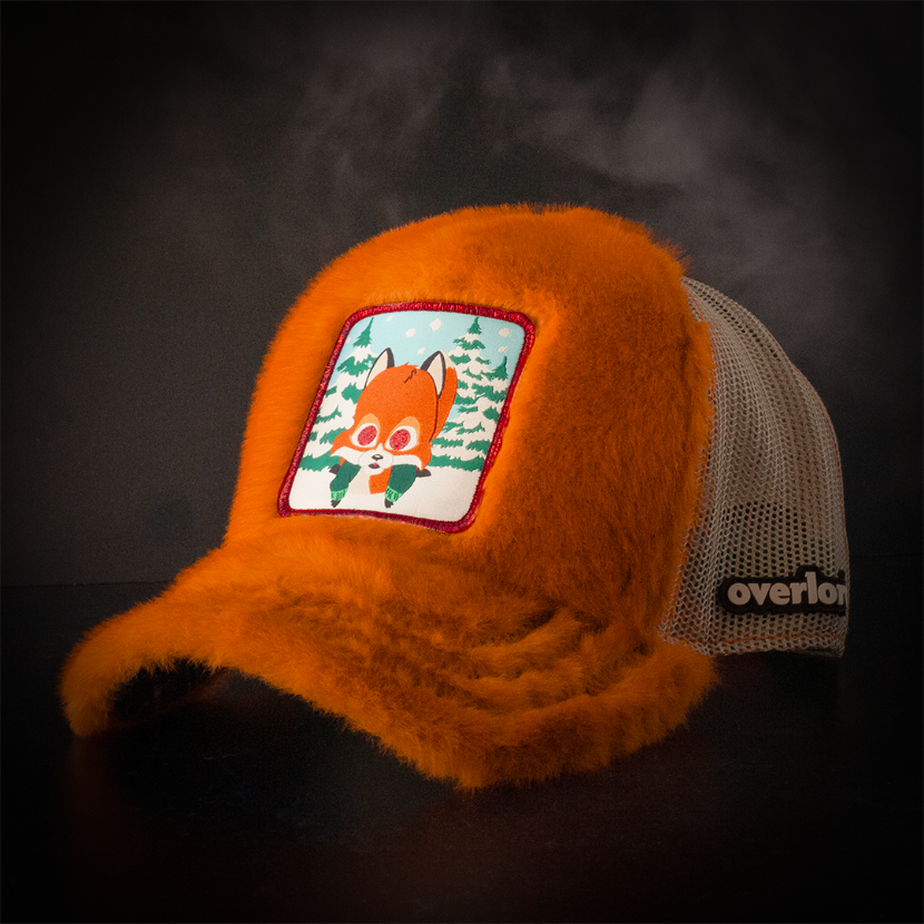 Faux fox fur trucker cap with khaki mesh featuring a woven patch of Woodland Critter Fox from South Park attached to the crown.