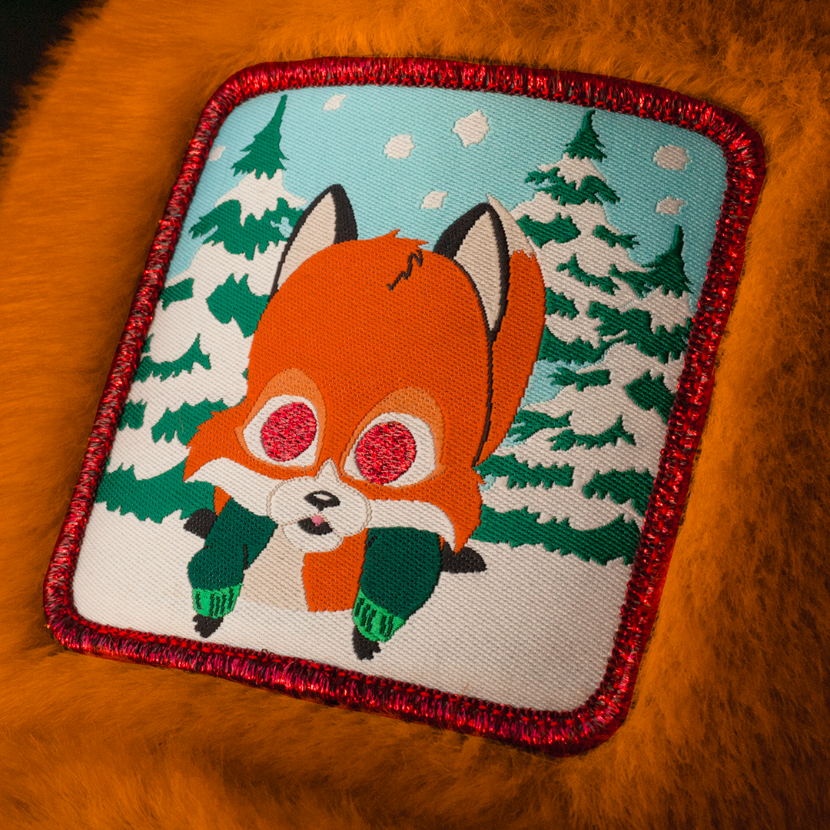 Close up of a woven patch of Woodland Critter Fox from South Park attached to the crown.