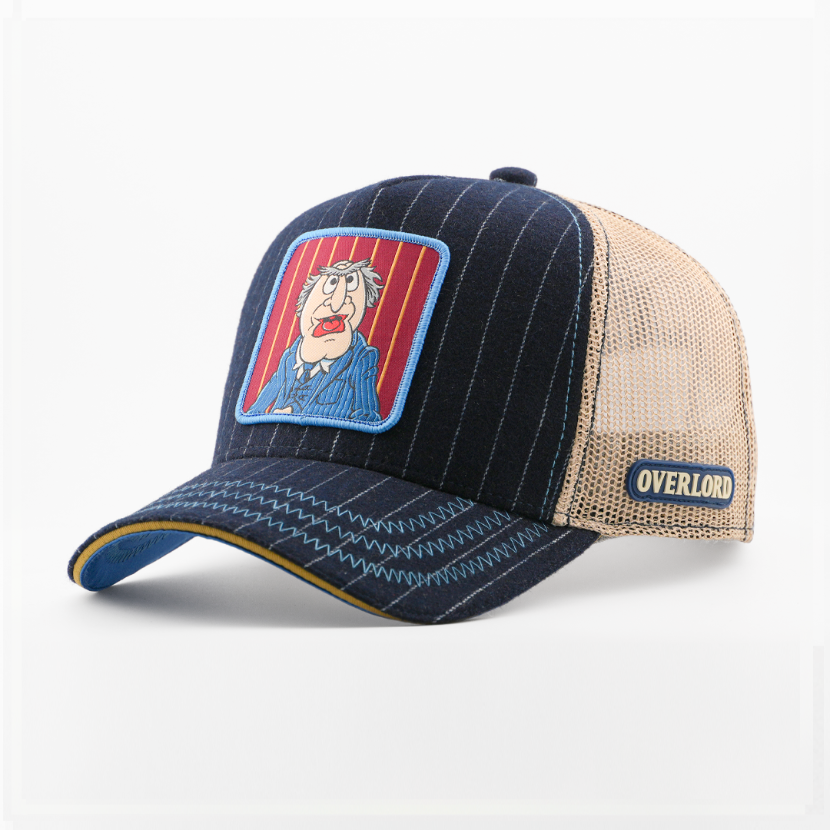 Navy pinstriped retro trucker cap with a patch of Waldorf from The Muppets on a red striped background, tan mesh back with navy Overlord logo.