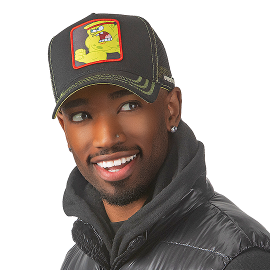 Man wearing black OVERLORD X SpongeBob Wrestling SpongeBob trucker baseball cap hat with yellow zig zag stitching. PVC Overlord logo.
